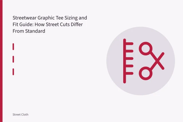 Boxy streetwear graphic tee laid flat with measuring tape across chest and body length. Streetwear Graphic Tee Sizing and Fit Guide: How Street Cuts Differ From Standard